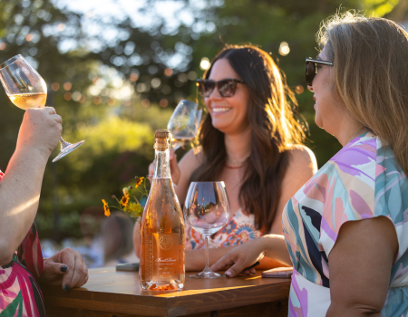 Guests enjoying Frank Family Brut Rosé on the Miller House lawn. 