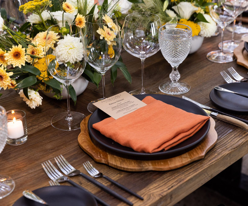 Details of a table setting for a dinner event in the courtyard