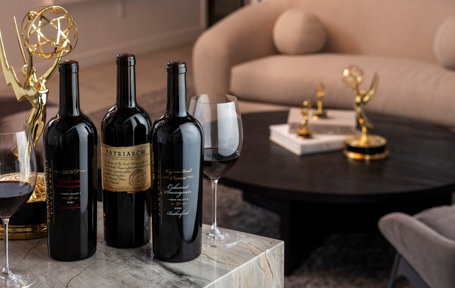 Three bottles of Reserve wine set against a backdrop of Rich Frank's Hollywood memorabilia.